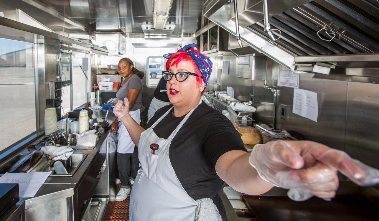 Woman working in a commercial kitchen.